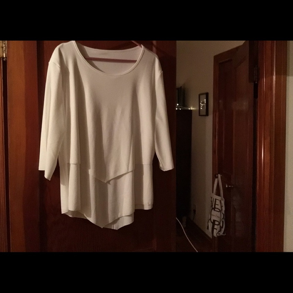 Layered silky-soft blouse in white. No tags